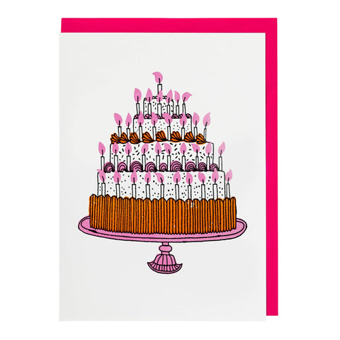 A greeting card featuring a colourful illustration of a birthday cake with lots of candles on a white background. Card comes with pink envelope.