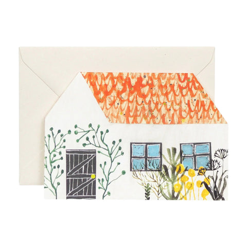 Greeting card with house illustration and envelope on a white background