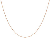 Rose gold choker necklace, with rose gold beads that are spaced out every 10 mm.