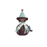 Roocking brown teddy bear with blue hat and stripy blue and white scarf.