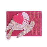 Card with doves holding a heart on a pink background