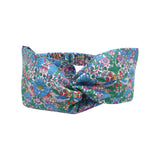 Liberty print twist headband on a white background.