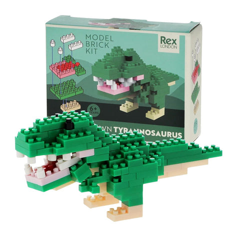 Model brick kit of a green T rex dinosaur with packaging in the background