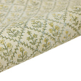 Roll of floral-patterned paper with yellow flowers on a beige background