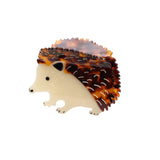 Hedgehog-shaped claw clip with tortoiseshell pattern on a white background