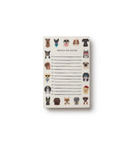 Notepad with dog illustrations and text on a white background