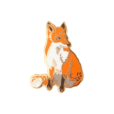 Enamel fox pin on white background