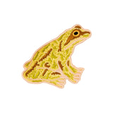 Embroidered frog patch on a white background