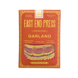 printed pink package with East End Press on the front, inside is a party cake garland.