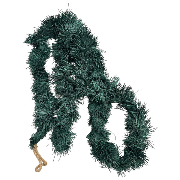 Green tinsel garland on a white background