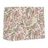 A square gift bag with a delicate floral and bird pattern in pink, green, and brown on a cream background, featuring a hanging paper tag.