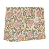 A square fabric gift bag featuring a vintage floral pattern with pink flowers and green leaves on an off-white background. A small paper brand tag is attached to the right side.