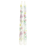 Two floral-patterned candles on a white background