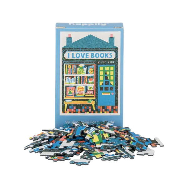 Puzzle box with 'I Love Books' design and scattered puzzle pieces on a white background