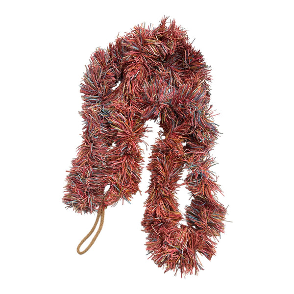 multi coloured tinsel garland on a white background