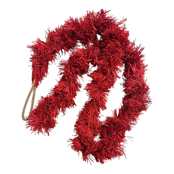 Red recycled paper-card tinsel garland on a white background