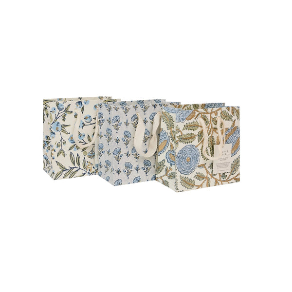 set of three small gift bags set on a w white background