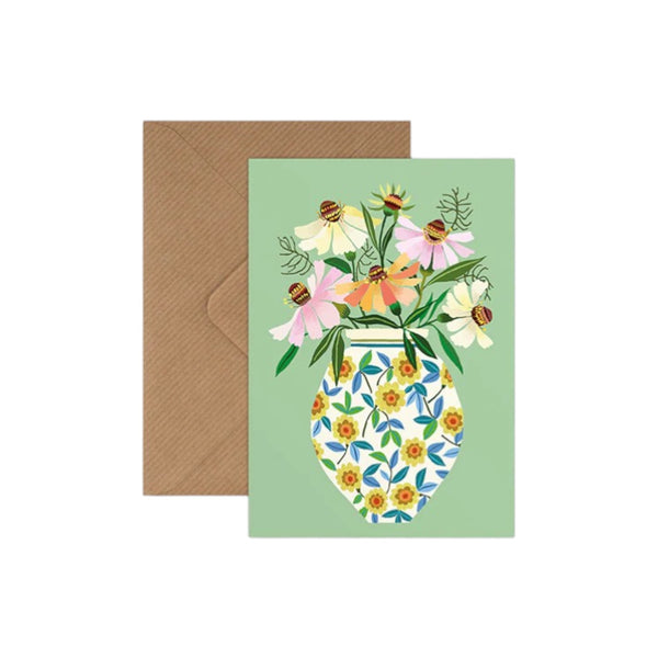 Greeting card with floral design and envelope on a white background