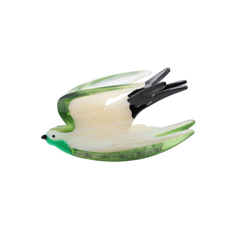 Bird-shaped clip with green and white design on a white background
