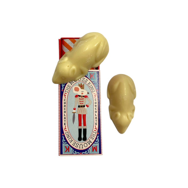Two white chocolate mice on a decorative box with a white background