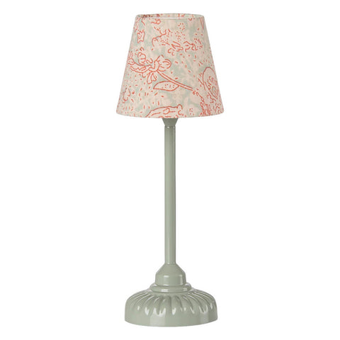 Small lamp with a floral-patterned shade on a white background