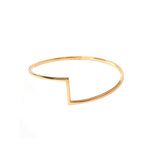 Flat backed bangle with rounded curved edges and a geometric design to the front of the bangle.