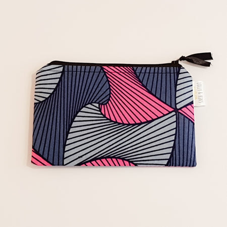 This versatile small fabric bag is pink with two shades of grey and the bold outline pattern is black and the wipe clean inner fabric is black.