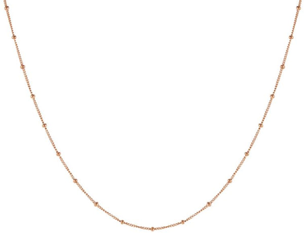 Rose gold choker necklace, with rose gold beads that are spaced out every 10 mm.