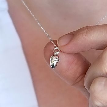 Baby acorn charm necklace made from solid silver on a silver chain.