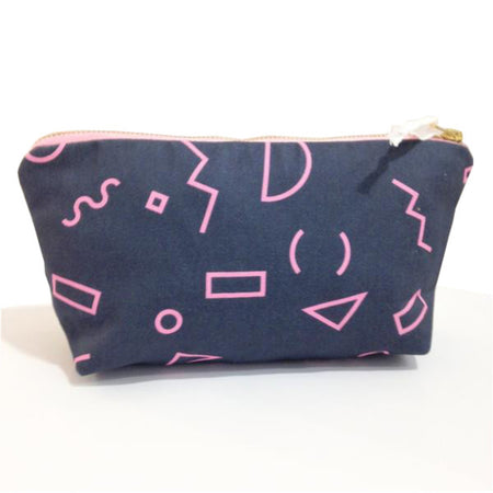 Zip case with a teal blue background and pink shapes.