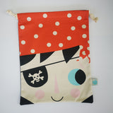 Cotton draw string bag with pirate face on the front and a scull and cross bones on the reverse.