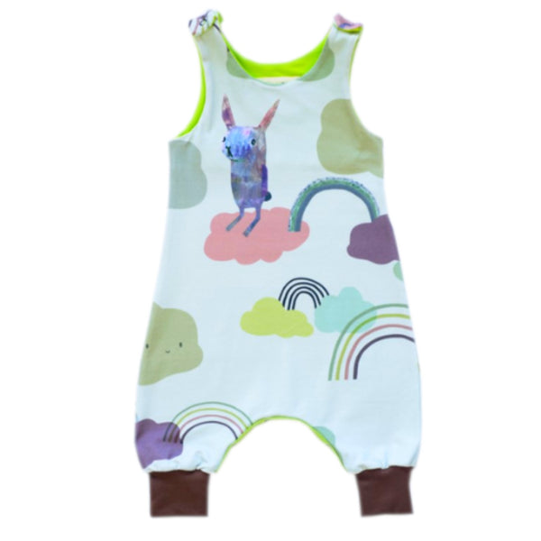 Organic cotton romper with rabbit, rainbow and cloud design on a pale blue background.